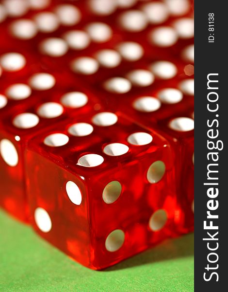 Macro shot of dices lined up on a green table. Macro shot of dices lined up on a green table