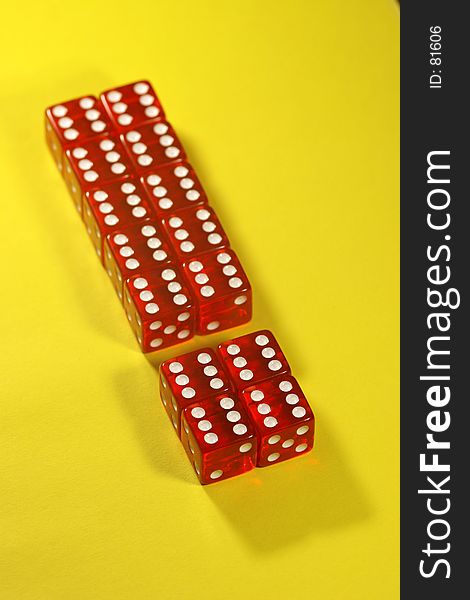 Exclamation mark made out of red dices on yellow backround. Exclamation mark made out of red dices on yellow backround