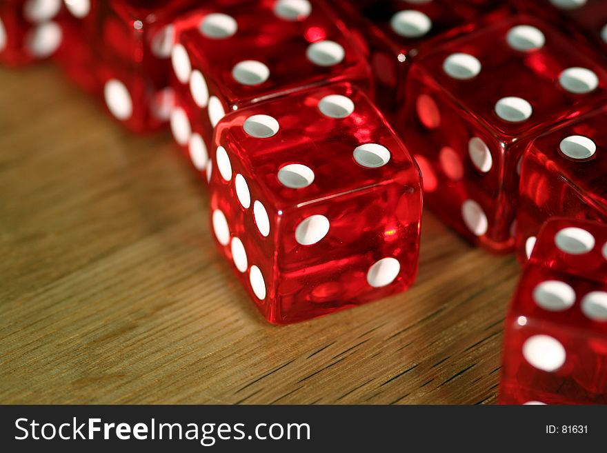 Close-up of dice on a wooden table. Close-up of dice on a wooden table