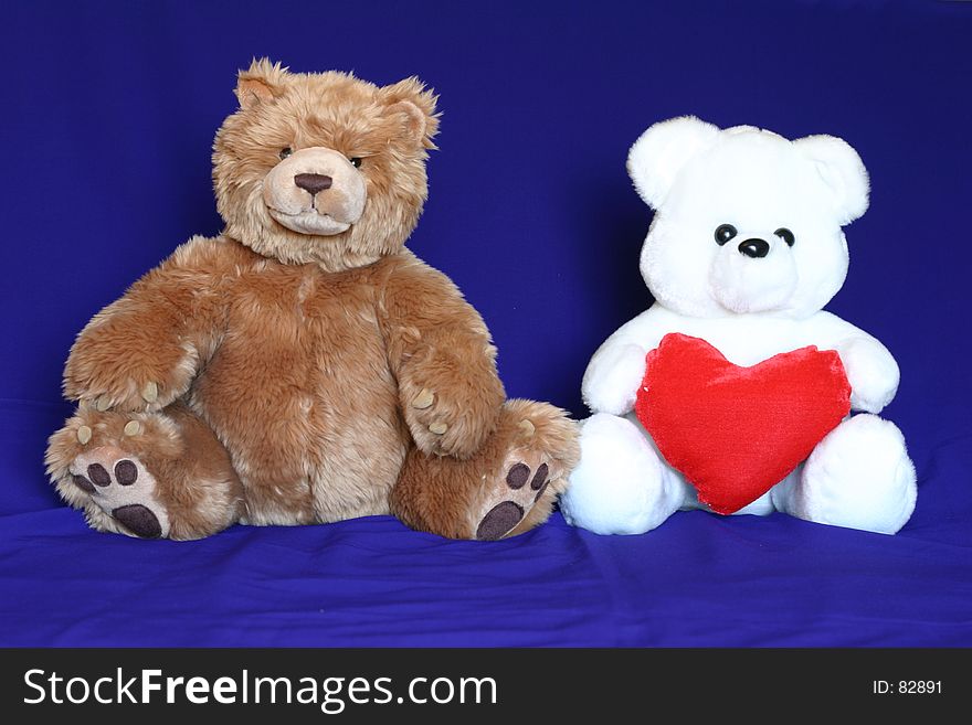Brown and white teddy bears. Could be used where inter racial love/marriage related materials. Brown and white teddy bears. Could be used where inter racial love/marriage related materials.