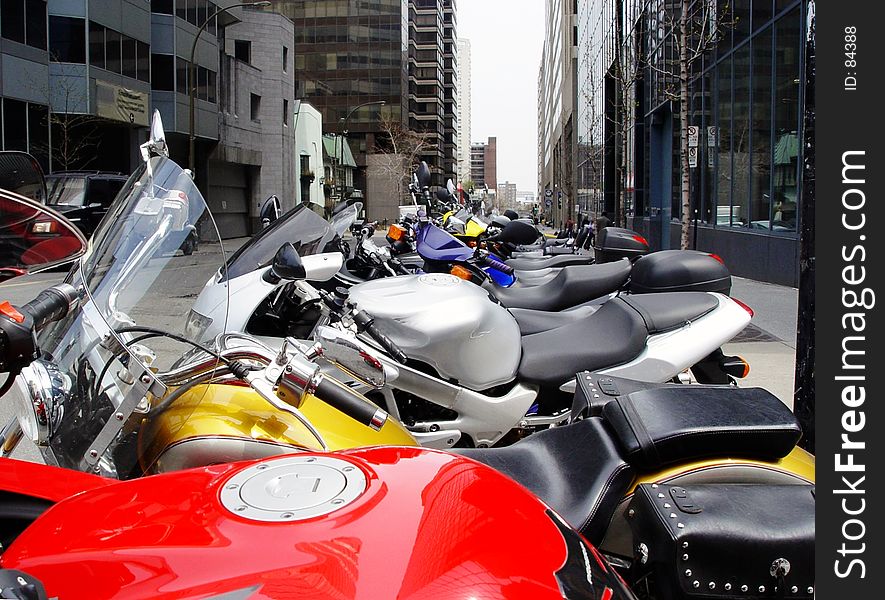 A row of colorful motorcycles in Montreal. A row of colorful motorcycles in Montreal