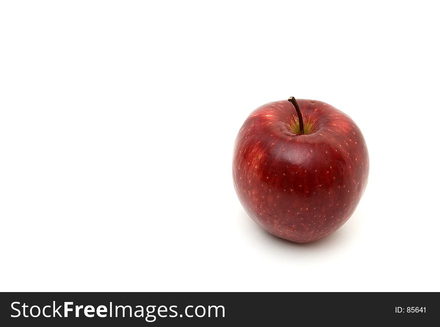 An isolated red apple on white background. An isolated red apple on white background