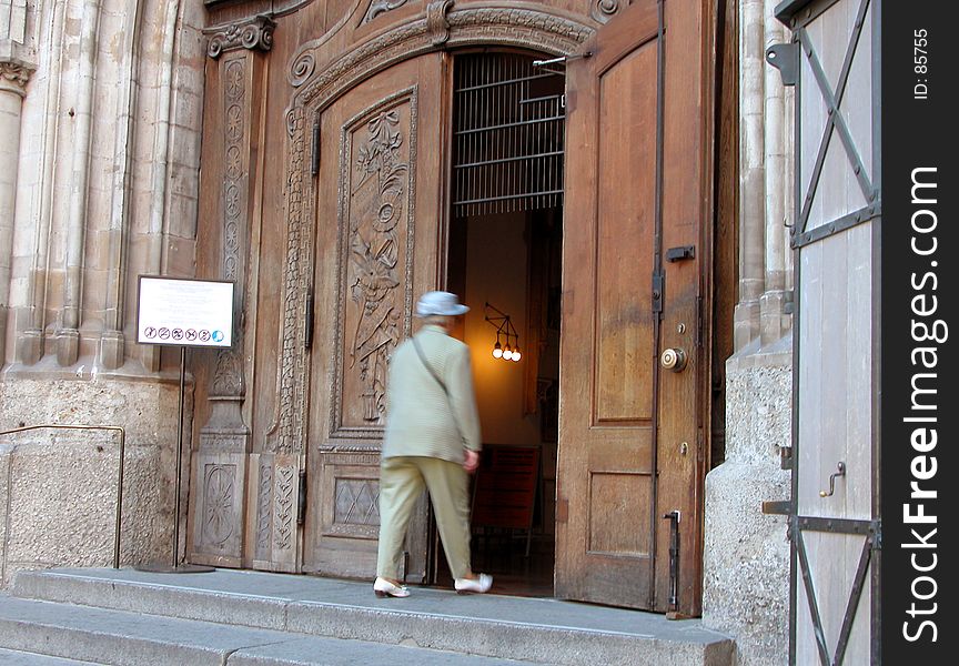An old woman entering into the cathedral-Munchen. An old woman entering into the cathedral-Munchen