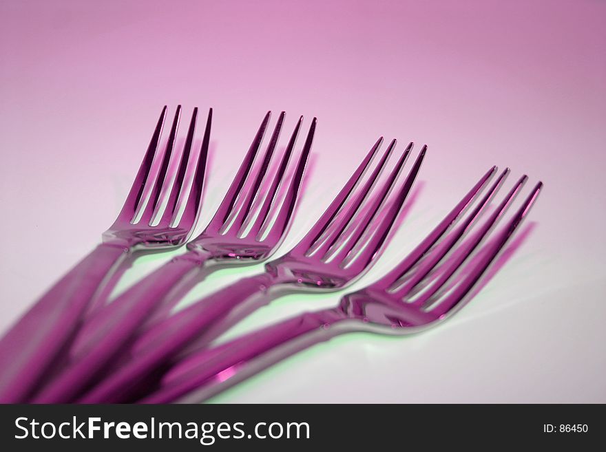 Macro of glowing purple forks