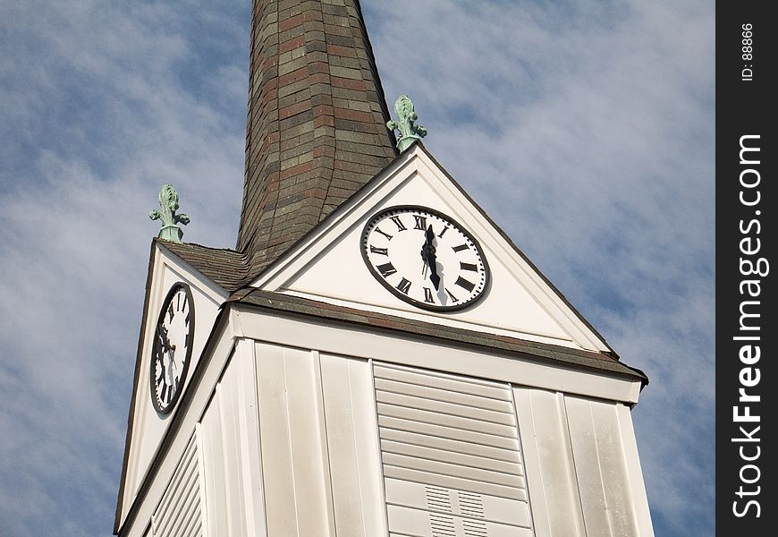 This is a shot of the steeple and a clock of an old wooden church located in Englishtown, NJ. This is a shot of the steeple and a clock of an old wooden church located in Englishtown, NJ.