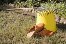 Rake Resting On A Bucket Stock Photos Rake Resting On A Bucket Stock Photos