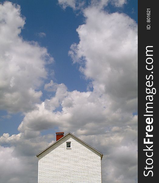 Landscape with the new built house against the blue sky. Landscape with the new built house against the blue sky