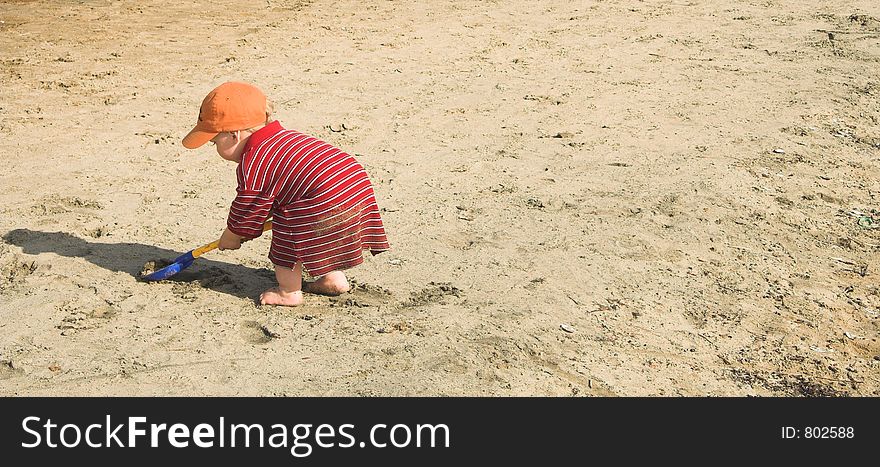 Boy Playing In Sand