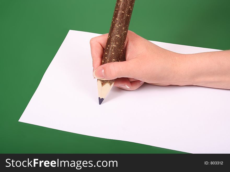 Hand with wooden pencil