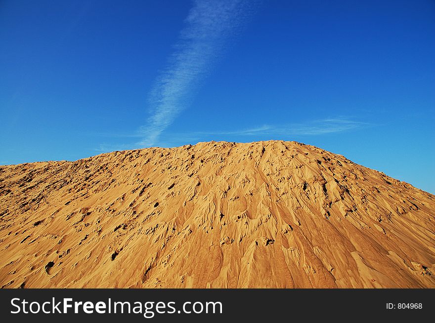 Lake sand on a background of the dark blue sky. Lake sand on a background of the dark blue sky.