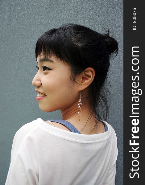 Attractive Young Korean Woman With Her Head Turned