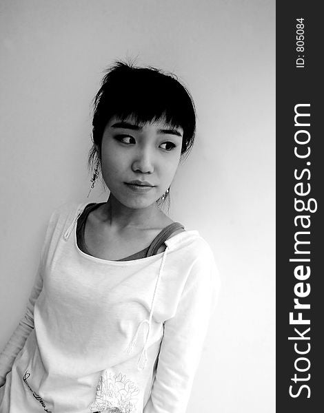 Looking doutbtful - Black and white portraitof an attractive young Korean woman