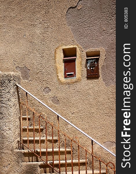 Corsica -France  in the summer: detail of shutter of an old house. Corsica -France  in the summer: detail of shutter of an old house