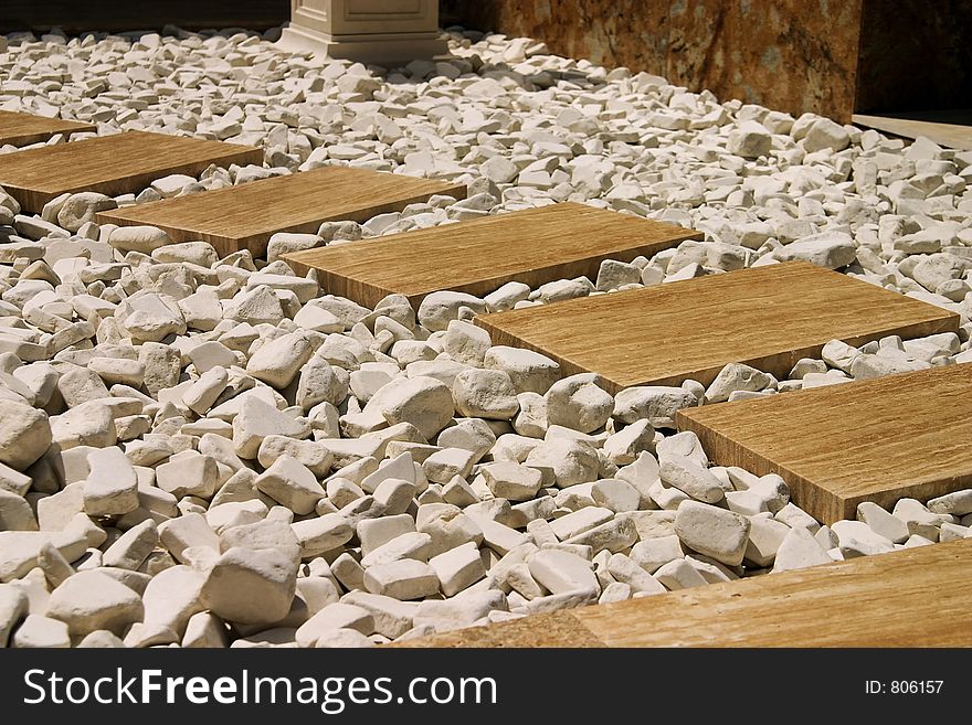 Abstract marble path design with white rocks