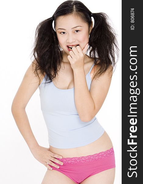 A young asian woman in colorful undergarments on white background