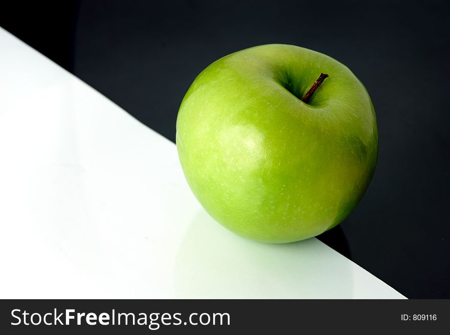 Granny Smith apple on artistic background