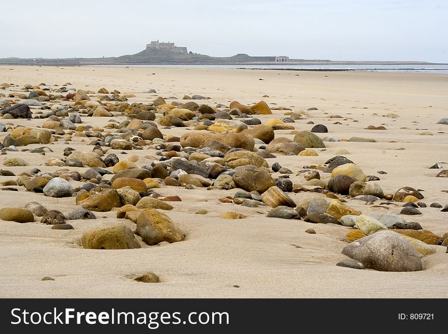 Sand, pebbles and Holy Island