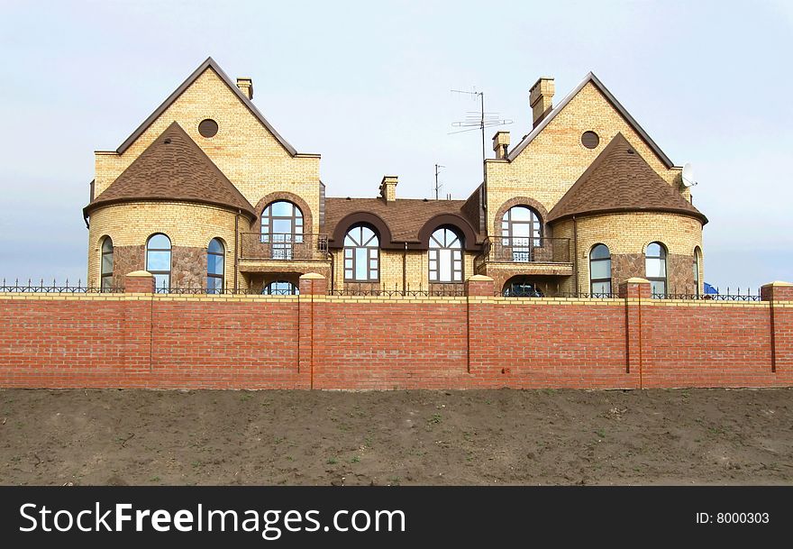 New modern brick fencing cottages in a row. New modern brick fencing cottages in a row
