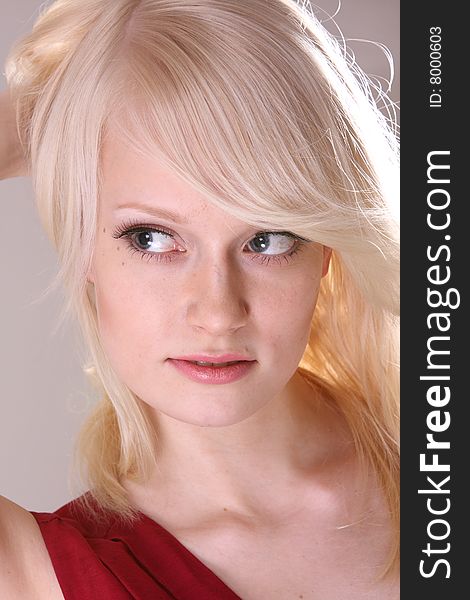 Beautiful blond fashion model posing in studio. Beautiful blond fashion model posing in studio