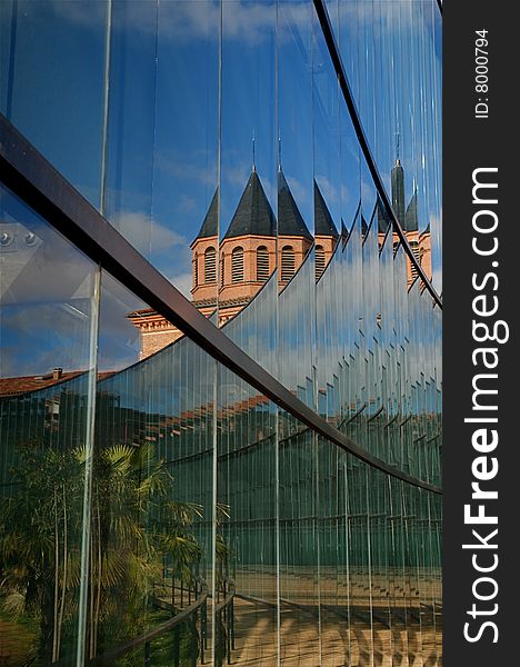 The reflection on the glass wall of the natural history museum in Toulouse