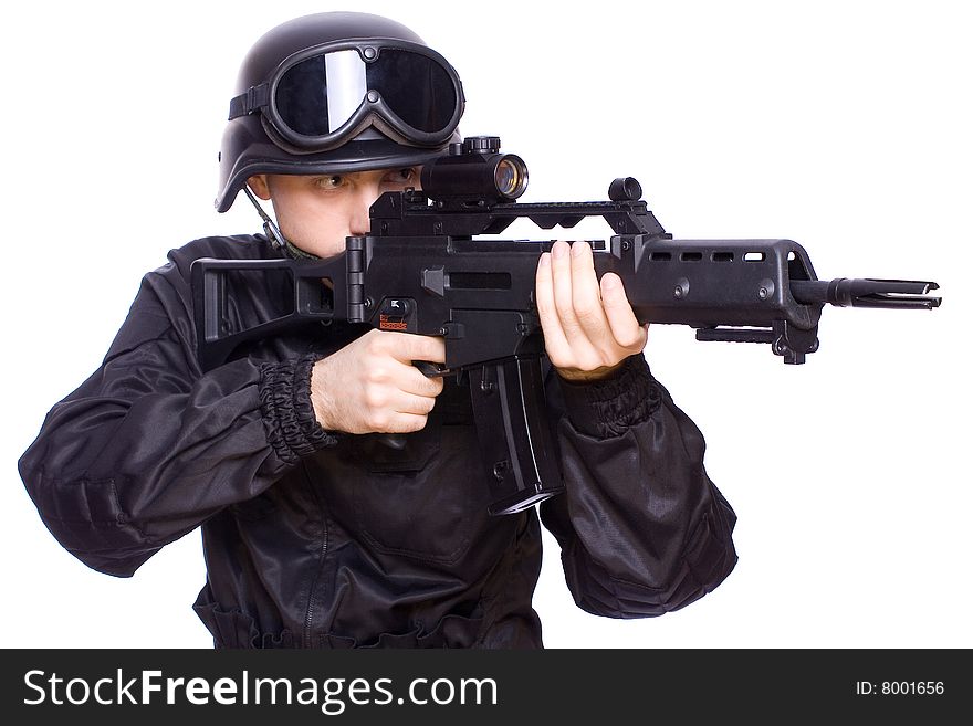 One soldier with the gun in the hands on a white background. One soldier with the gun in the hands on a white background