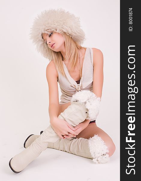 Young girl in furry hat, studio shot