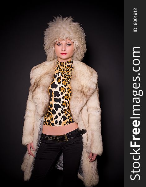 Sensual girl in furry hat and coat