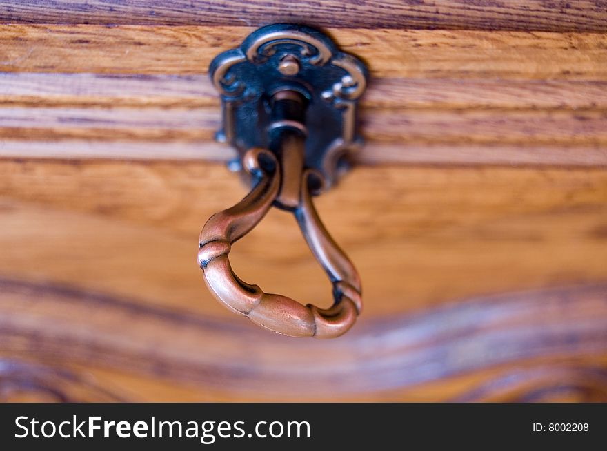 Antique key in locked door