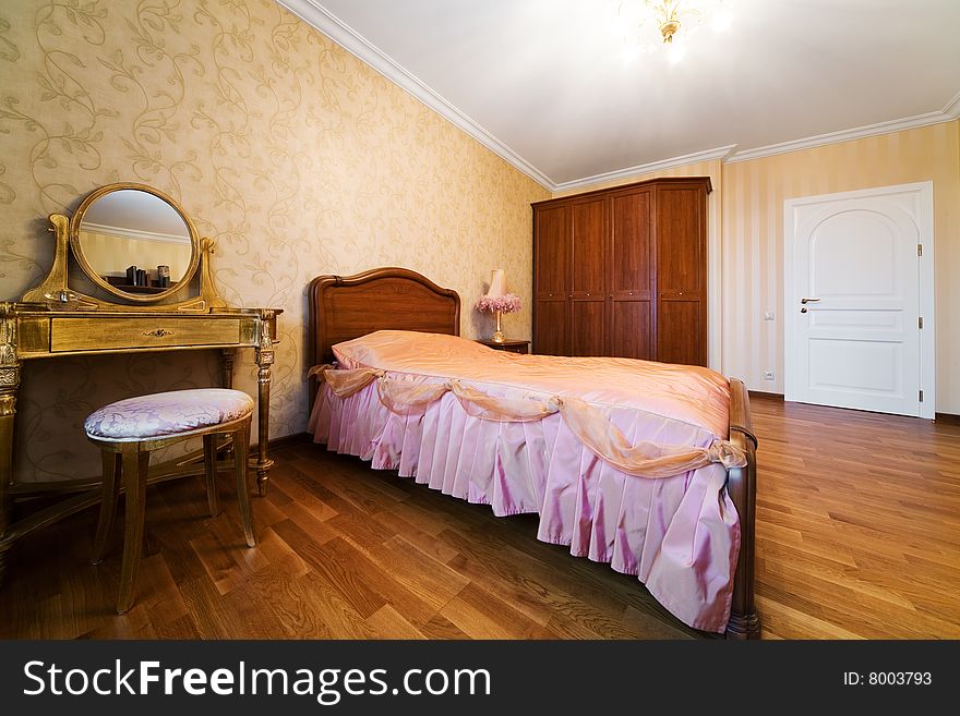 Bedroom with dressing table in modern apartment