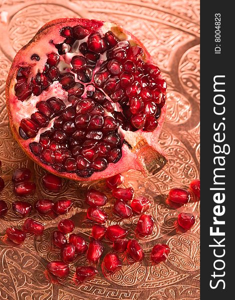 Broken ripe pomegranate fruit red