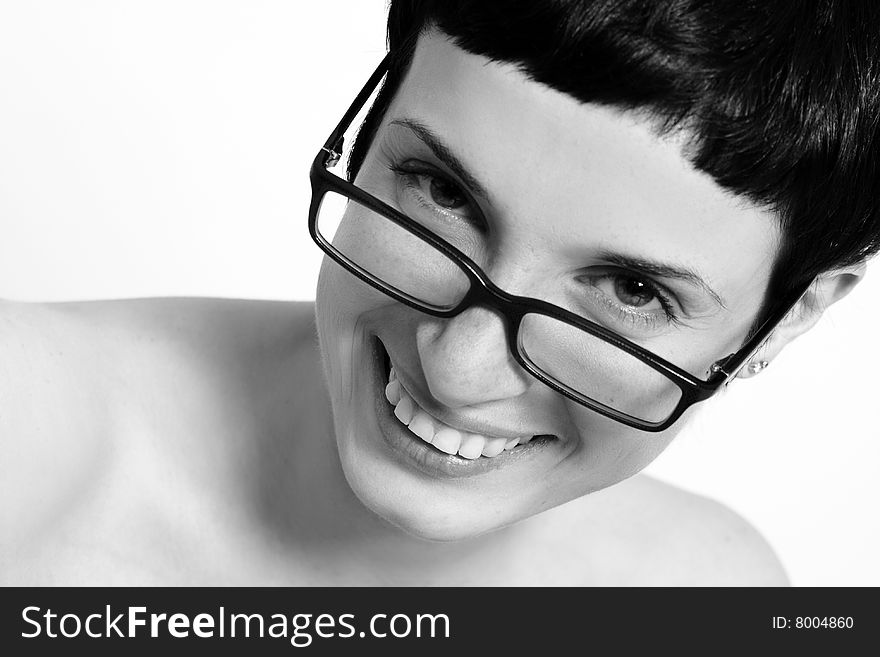 Black and white  portrait of a girl with short hair wearing glasses. Black and white  portrait of a girl with short hair wearing glasses