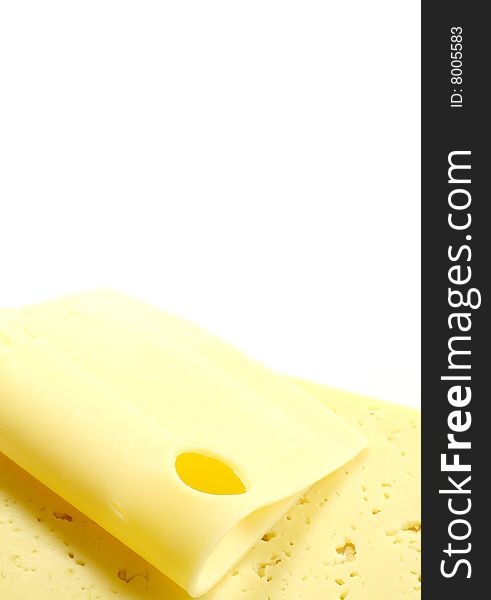 Two pieces of cheese on a white background, closeup. Two pieces of cheese on a white background, closeup