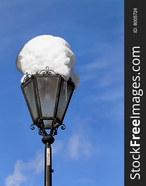 A streetlight and the snow in the sky