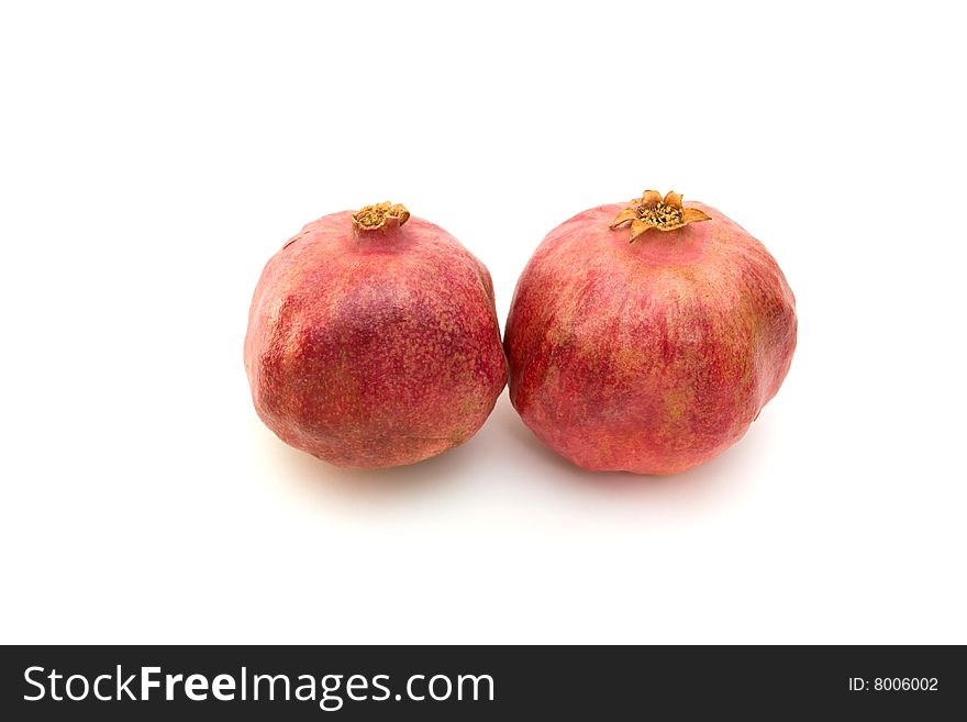 Two red pomegranate isolated on white. Two red pomegranate isolated on white