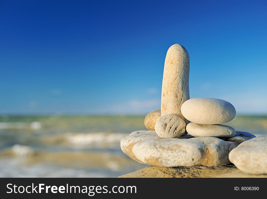 Sea pebble in morning light on a beach in the summer. Sea pebble in morning light on a beach in the summer