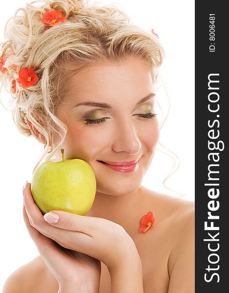 Beautiful young woman with ripe green apple. Spring concept