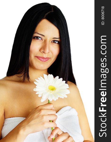 Beautiful young spa woman holding a flower against white. Beautiful young spa woman holding a flower against white.