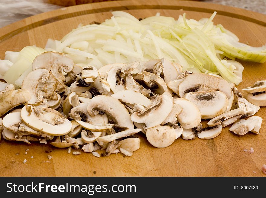 Champignons with bulb on kitchen table