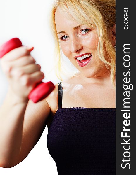 Attractive young woman excercising against a white background. Attractive young woman excercising against a white background.