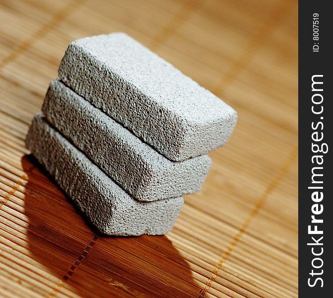 Stack of pumice stones on top of a bamboo mat. Stack of pumice stones on top of a bamboo mat.