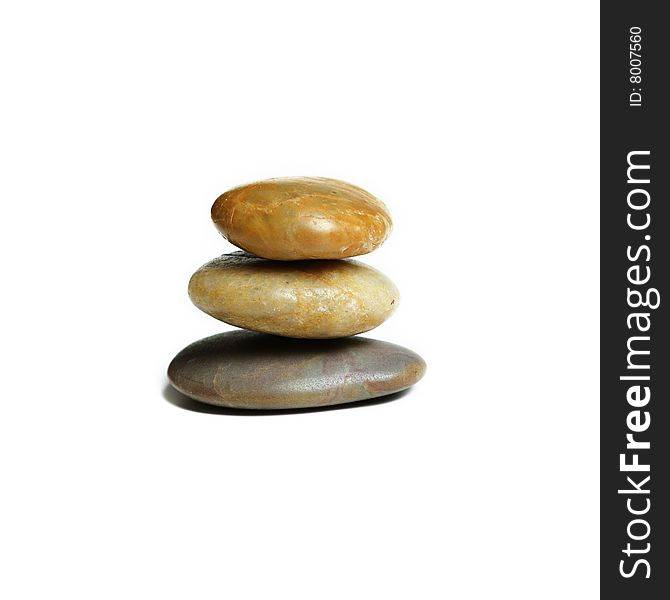 Stack of stones against a white background. Stack of stones against a white background.