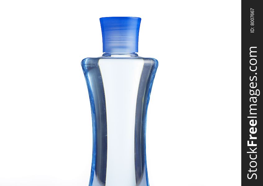 Blue shampoo bottle against a white background.