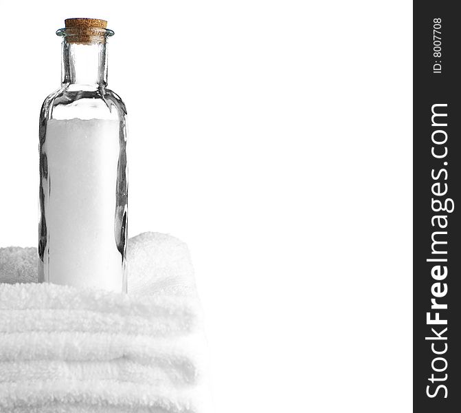 Bath towels and bath salt against a white background. Bath towels and bath salt against a white background.