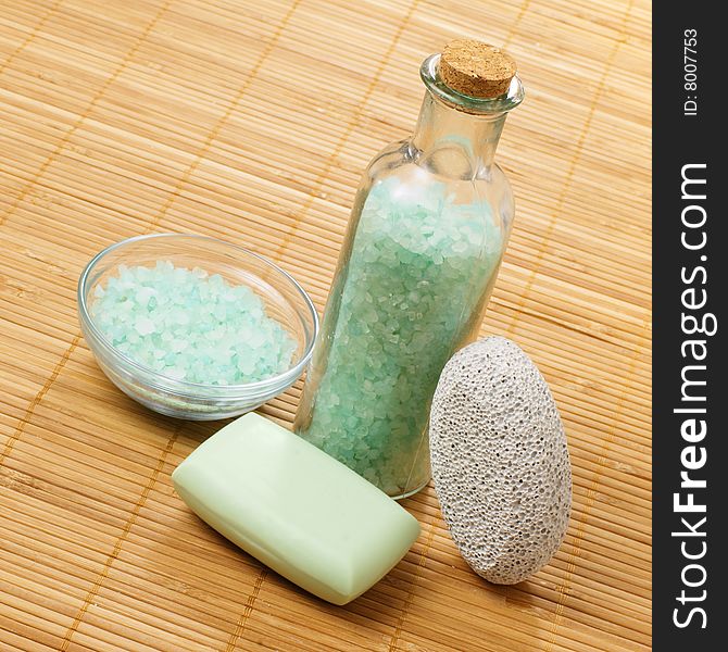 Bath products on display against a bamboo mat. Bath products on display against a bamboo mat.