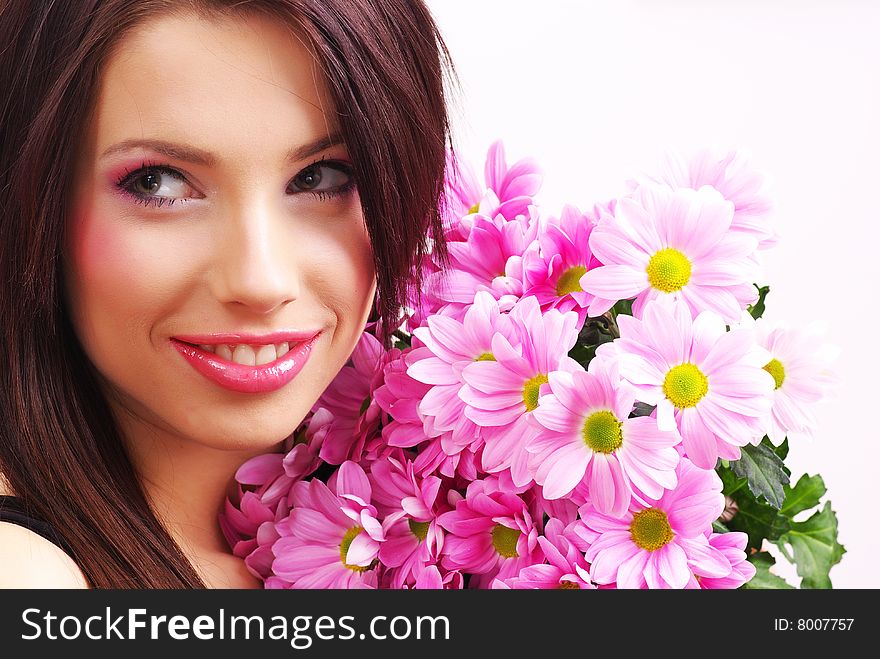 Attractive young woman face with flowers. Attractive young woman face with flowers