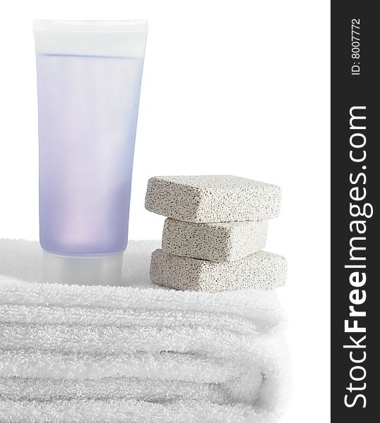 A spa scene on top of fluffy white towels against a white background.