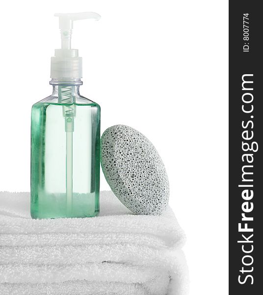 A spa scene on top of fluffy white towels against a white background.