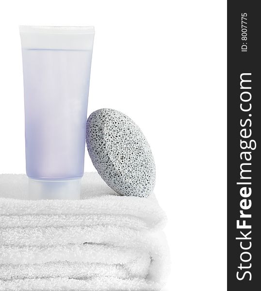 A spa scene on top of fluffy white towels against a white background.