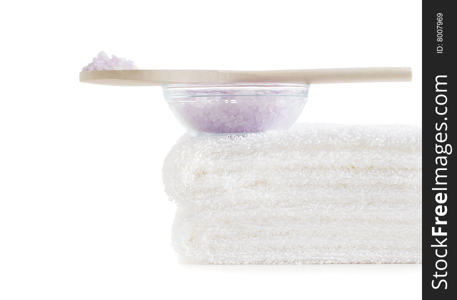 Towels and bath salt being displayed against a white background. Towels and bath salt being displayed against a white background.