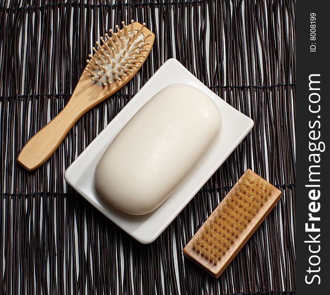 Decorative soap display on a bamboo mat.